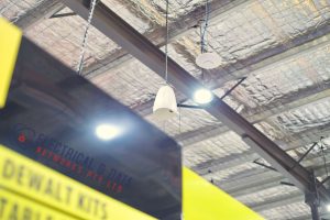 Retail AV installation Total Tools Melbourne with ceiling speaker, lighting and wall mounted TV display